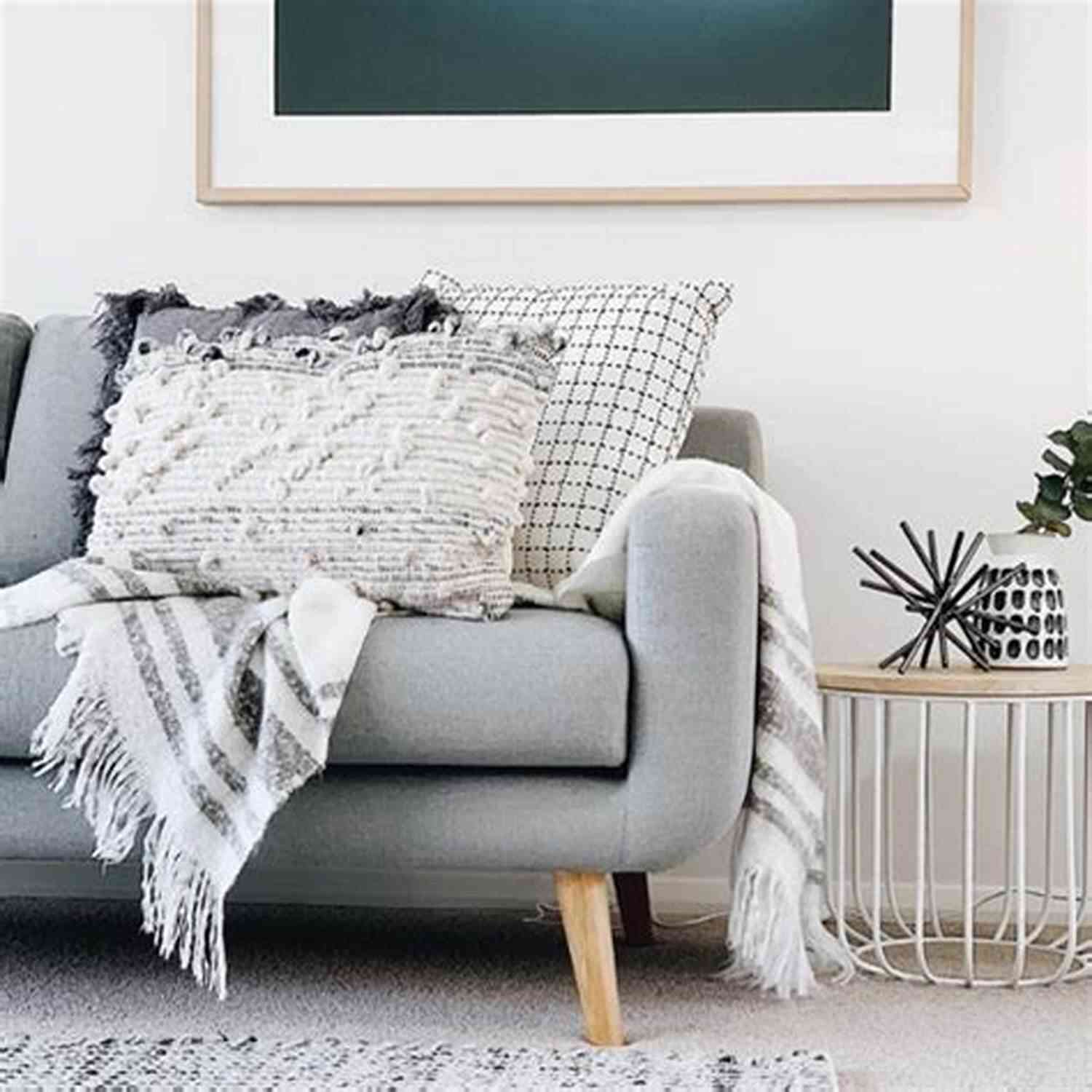 A Colorful Corner To Corner Lap Throw Draped Over A Couch, Adding Charm To The Room Corner To Corner Lap Throws For The Family (Annies Crochet)