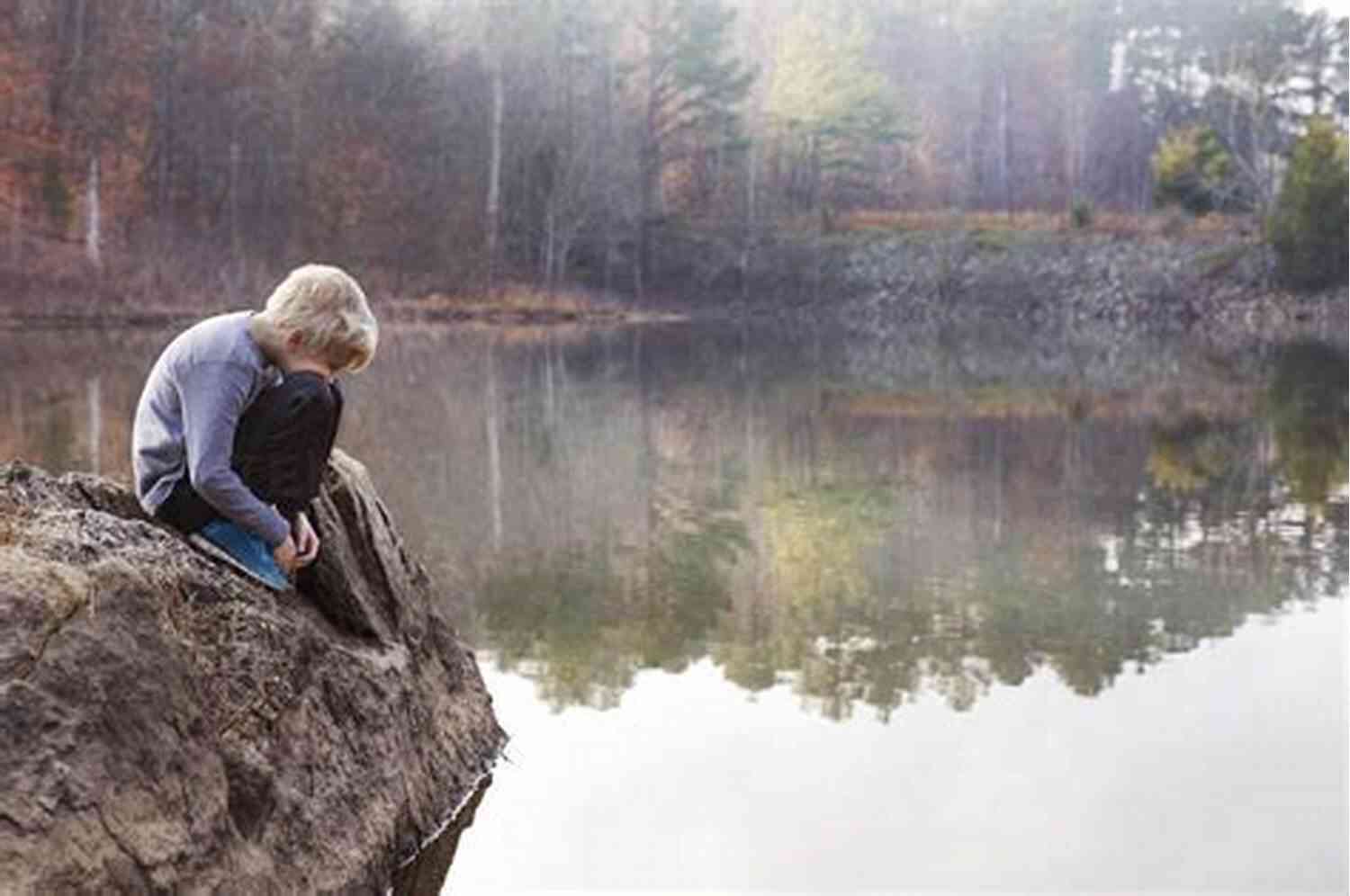 Thoughts Of Lost Boy Lonely Boy Sitting On A Rock Near A Misty Forest Thoughts Of A Lost Boy