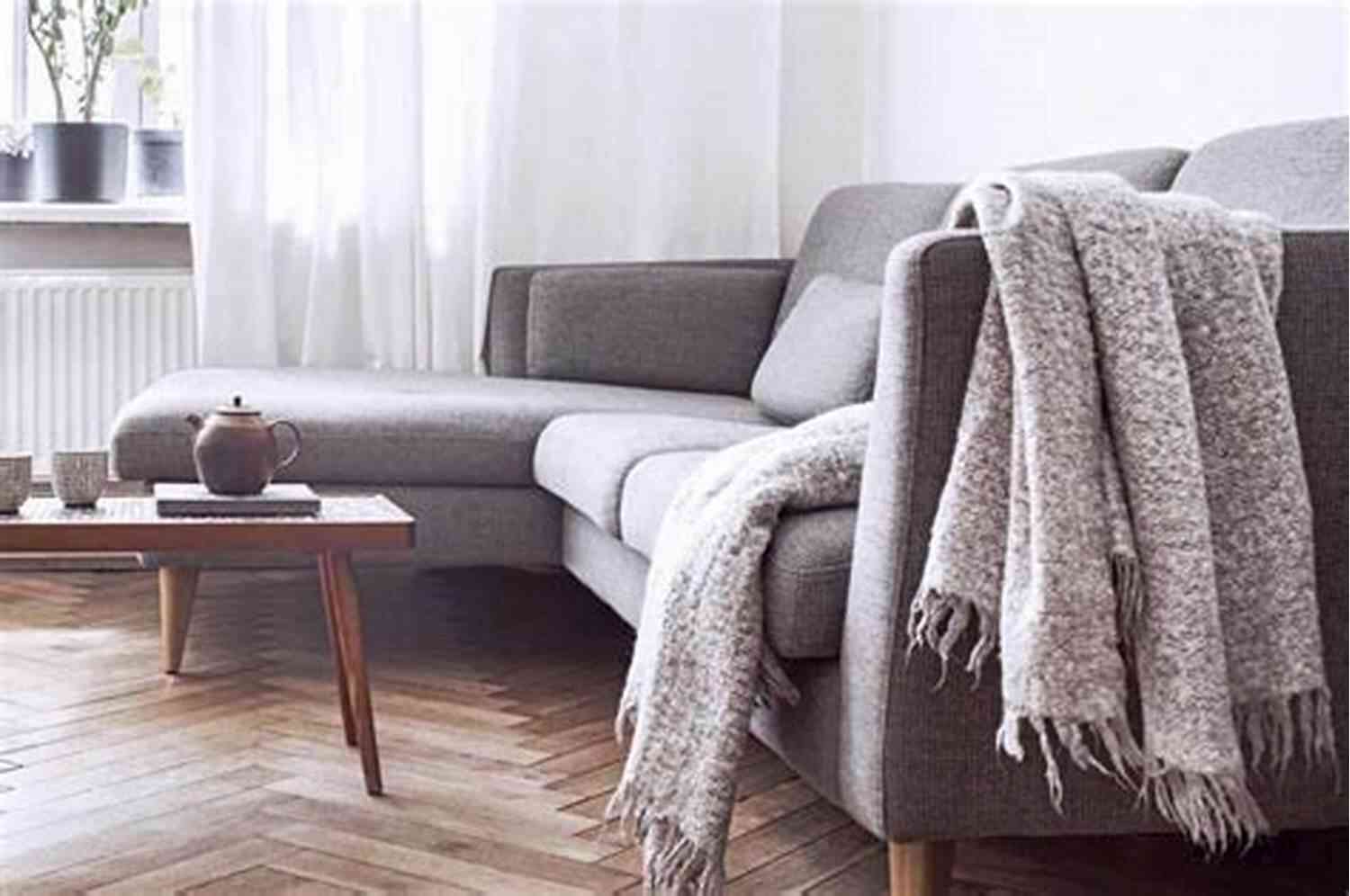 Finished Alternative Aran Throw Draped Over A Couch Alternative Aran Throw: Knitting Pattern